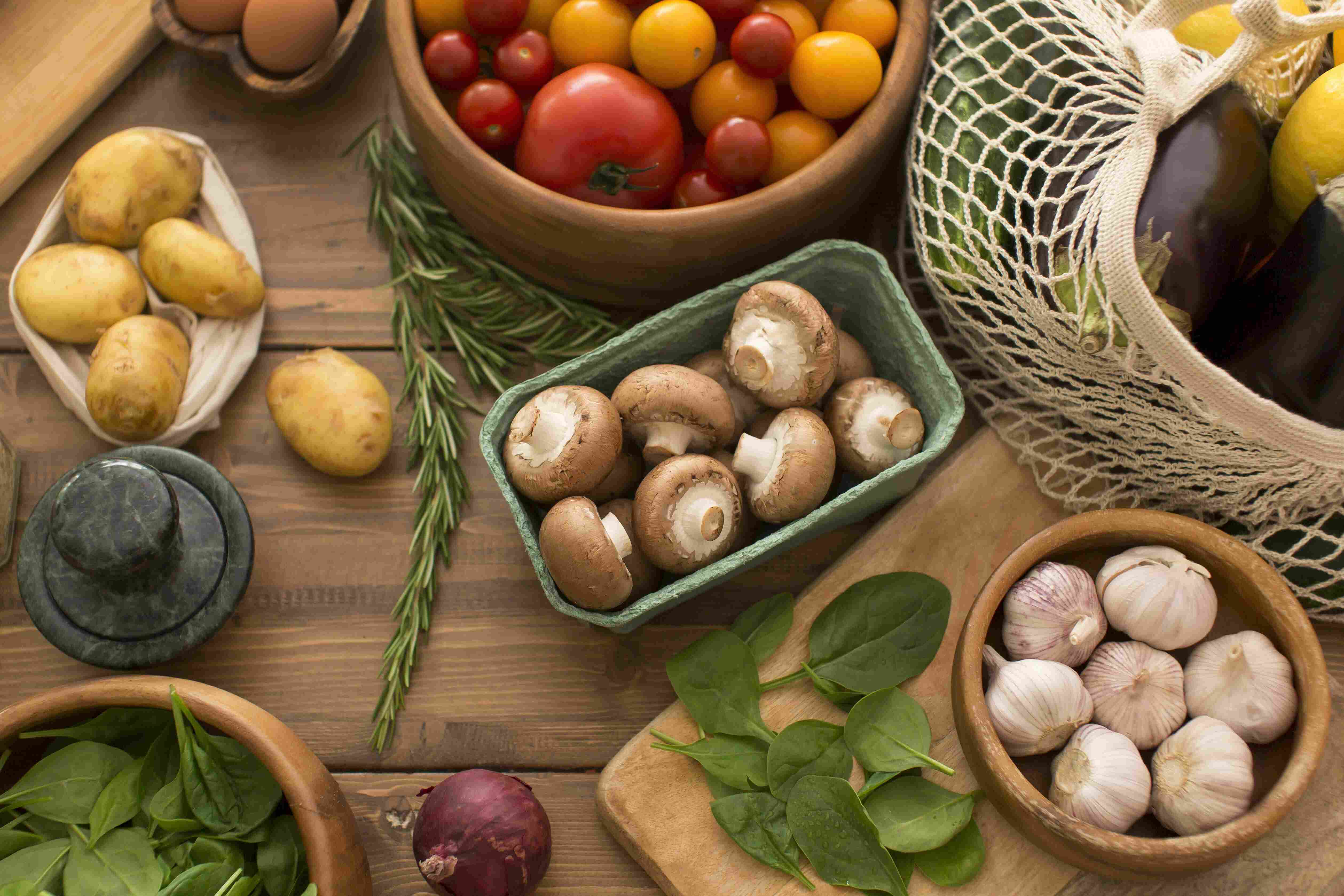 Fresh organic products including vegetables, herbs, and mushrooms